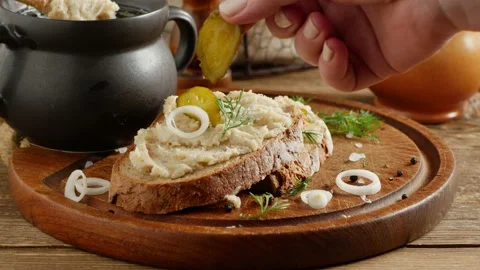 Lard sandwich. The cook decorates the bread with a sprig of dill. Stock Footage 147870834