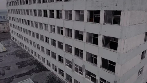 A large abandoned building with many broken windows and frames Stock Footage 150363562