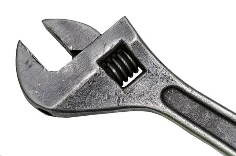 Large adjustable wrench on a white background. Insulated object. Old worn too Stock Photos