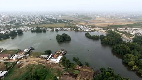 Large aerial view Wouri river, three boats and a pirogue Stock Footage 80593827