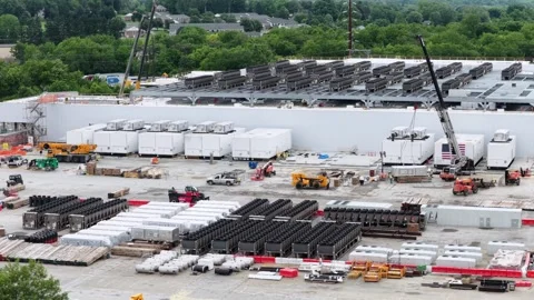 Large AI data center construction site with cooling units, cranes, staged Stock Footage 337691789