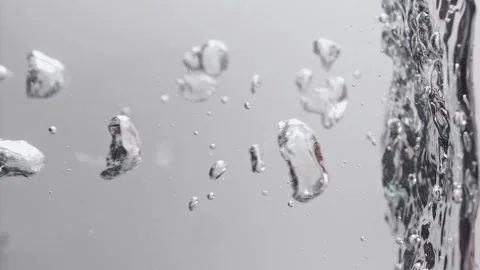 Large air bubbles in water in slow motion on light background. Vertical video. Stock Footage 273076627