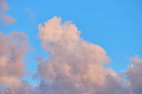 Large air clouds in summer in the evening sky Stock Photos