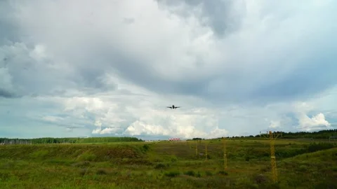 Large airliner with passengers is landing on landing strip at airport Stock Footage 280079804