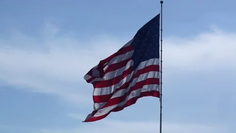 Large American Flag Waving in Wind at Slow Motion Stock Footage 77610287