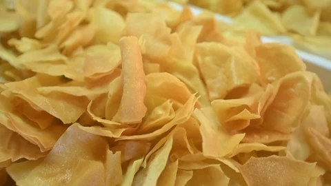 Large amount of fried snacks, traditional Sardinian pane guttiau bread Stock Footage 109001374
