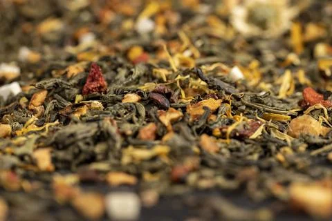A large amount of large-leaved green tea with the addition of fruits and berr Stock Photos