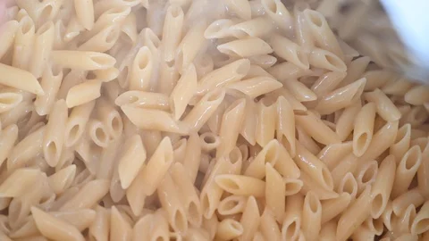 Large amount of pasta that cooks in a large pot in country festival Stock Footage 105998243
