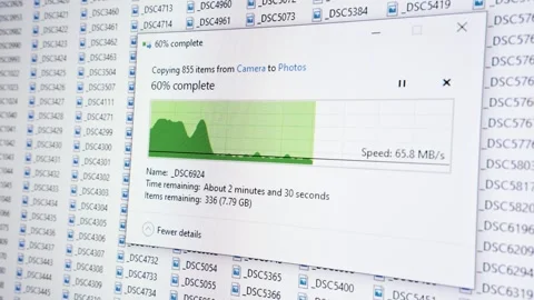 Large amount of photos getting copied from camera to computer. Progress Stock Footage 276580633