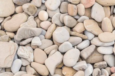 Large amount rounded and polished beach rocks Foto stock
