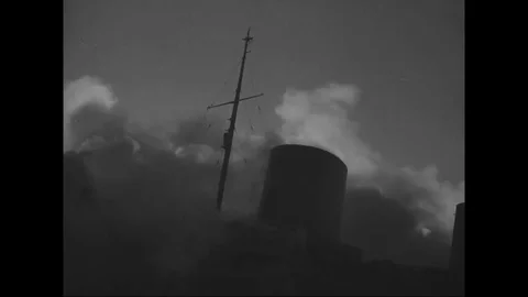 A large amount of smoke billows from burning SS Normandie at Pier 88 - 1942 Stock Footage 101729006