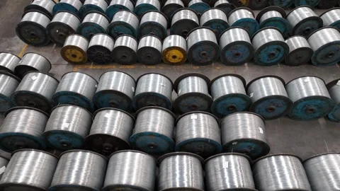 Large amount of spools of steel wire are stored in factory. industrial grad.. Stock Footage 284925476