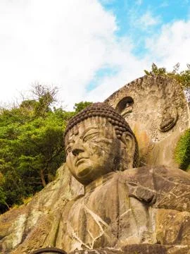 Large ancient Buddha statue on Mount Nokogira in Japan. Stock Photos