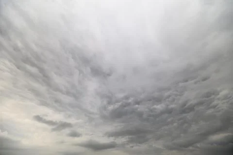 A Large and Dramatic Overcast Sky Featuring Dark, Brooding Clouds Full of Emotio Stockfoto's