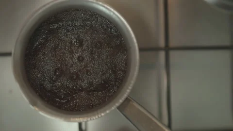 Large and a frame of fragrant brewed coffee that begins to boil in the morning Stock Footage 147847472