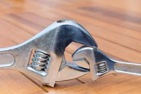 Large and small adjustable wrenches together Stock Photos