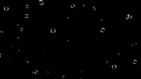 Large and small air bubbles rise from the bottom up against a black background. Video stock 153768120