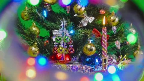 Large and small Christmas trees with gifts on a green background Stock Footage 144667013