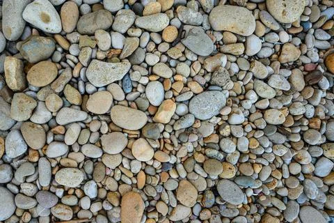 Large and small colored pebbles. Abstract background. View from above Stock Photos
