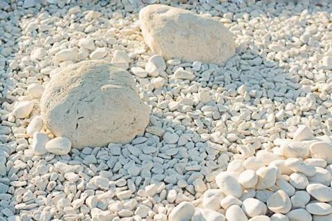Large and small. Dazzling white stones of different sizes, illuminated by the Stock Photos