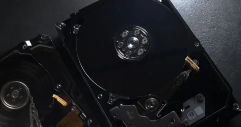 Large and small Hard Drive storage. Hard Disk spinning up and stopping again Stock Footage 132082474