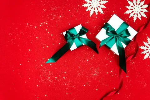 Large and small white gift boxes tied with a green satin ribbon Stock Photos