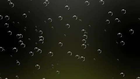 Large and small white soap bubbles rise up against a black background. Stock Footage 151813404