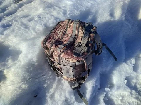 Large and tightly packed backpack for traveling in the snow. Stock Photos