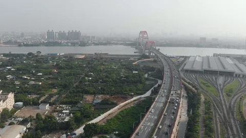 Large arched bridge over the river. Speedway in the city. Cargo ships Video stock 113799438
