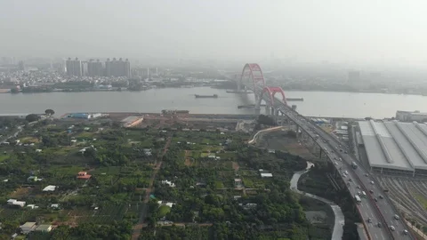 Large arched bridge over the river. Speedway in the city. Cargo ships Stock Footage 113799603