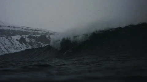Large Arctic storm wave with mist rising off top, in-water perspective Stock Footage 303834388