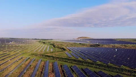 A large area is covered with solar panels. The sun is reflected from solar panel Stock Footage 134490375