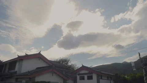 A large area of white clouds illuminated by the sun in the old town of Lijia Stock Footage 148518108
