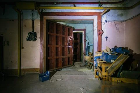 Large armored blast proof iron door inside bomb shelter Stock Photos