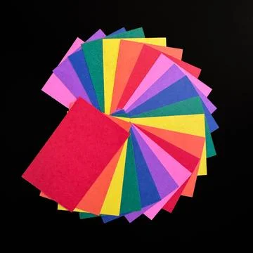 Large array of colorful papers on a black background Stock Photos