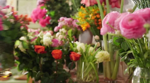 Large array of flowers in florist shop. Slow motion Stock Footage 62473316