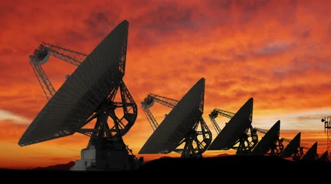 Large Array of Satellite Dishes at Sunset Stock Footage