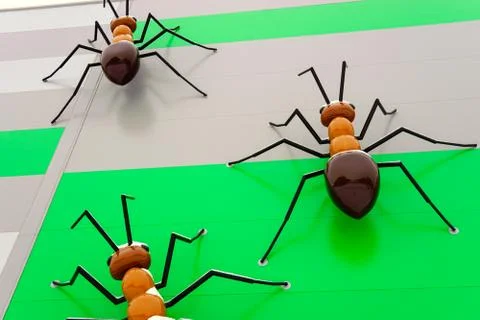 Large artificial decorative ants on a wall Stock Photos