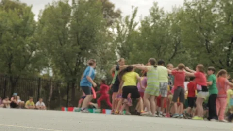 Large assembly of schoolchildren moving around Stock Footage 108703882