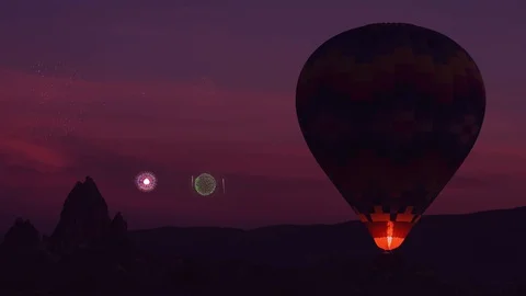 Large balloon with burning fire rises up flying in the valley Video stock 115217037