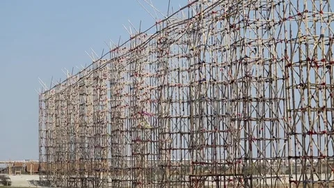 Large bamboo scaffolding structure under construction outdoors Stock Footage 331276948