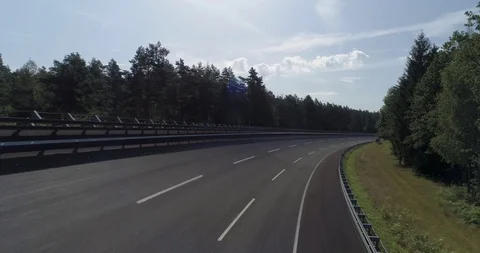 Large banked circuit race track going through forest drone aerial 4k Stock Footage 124647520