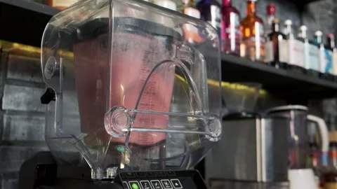 Large bar blender mixes cocktail ingredients Stock Footage 221508778