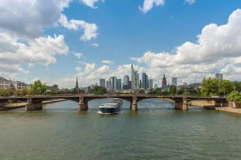 Large barge moving upstream in front of the skyline, Frankfurt, Germany Stock Photos