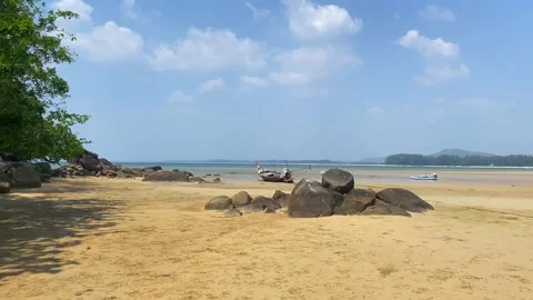 Large beach full of rocks and boats. Stock Footage 239523686