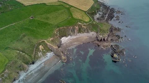 Large beach with rock formations from a cliff. Tra na mB Stock Photos