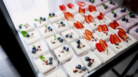 A large, beautiful, bright buffet with many sweet snacks, is waiting for guests Video stock 188539391