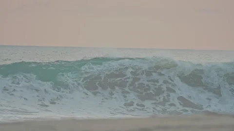 Large, beautiful ocean waves crash on the sandy shore of puerto escondido Stock-Footage 342737878