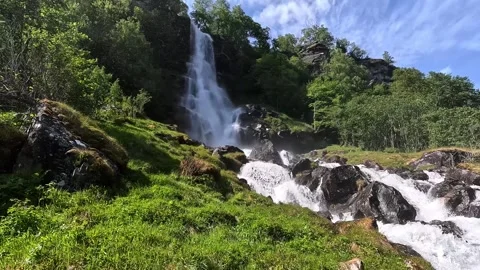 A large beautiful waterfall among the mountains Stock Footage 337364947