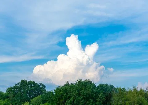 A large beautiful white cloud in the shape of a sign of victory V Stock Photos